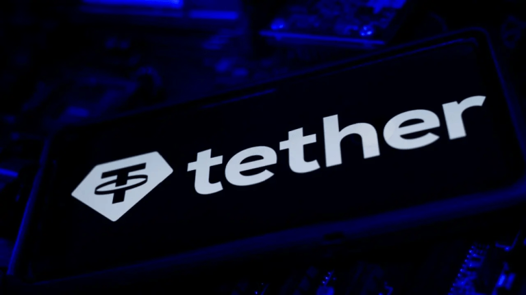 Tether logo on a dark smartphone at night.