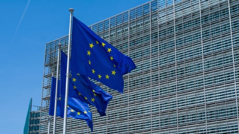 EU flags in front of the European Commission in Brussels