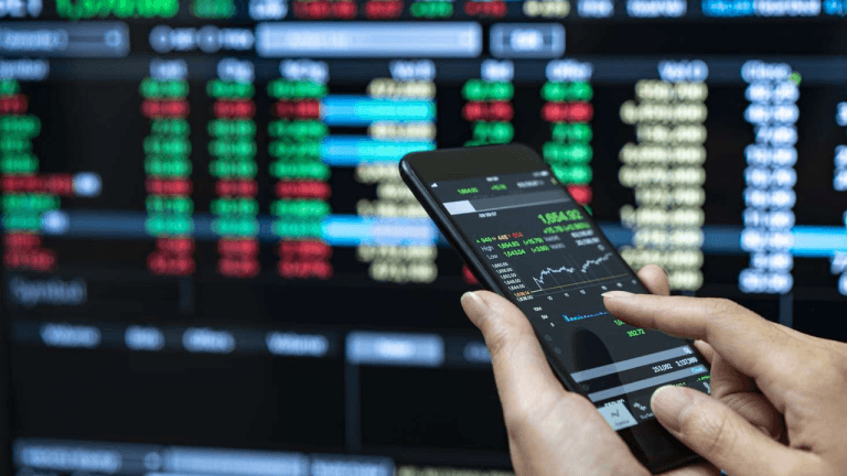 User conducting trading activities using a phone