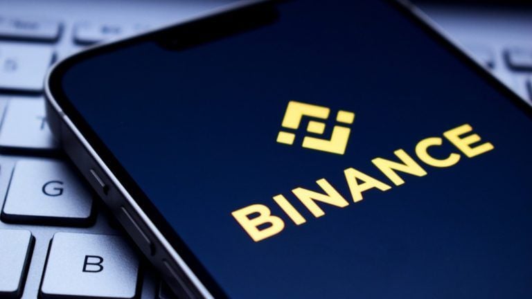 Binance logo on mobile phone