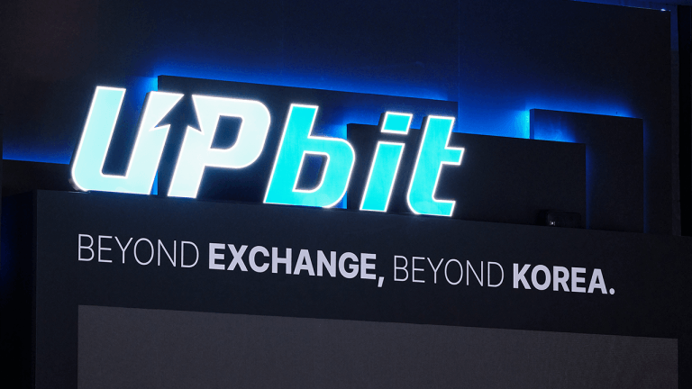 Upbit logo at a conference - Bitcoin.com Image